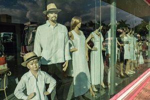 Male mannequins wearing a shirt with four pockets.