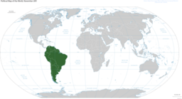 Map of the world in gray with the green covering the Southern part of the America starting Colombia Southernwards